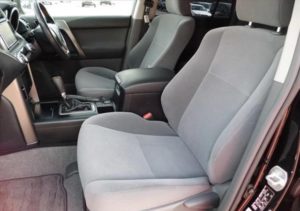The front seats of a used 2009 Toyota Land Cruiser Prado from online Japanese used car dealer BE FORWARD.